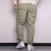Pánské jednobarevné tkané ležérní kalhoty s rovnými nohavicemi Converse světle šedé zelené